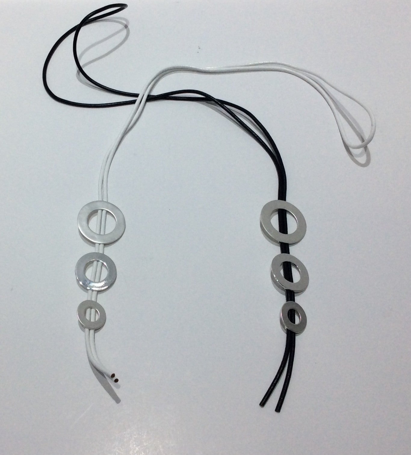 Necklace-Long cord bolero style with 3 descending in size silver metal disc beads